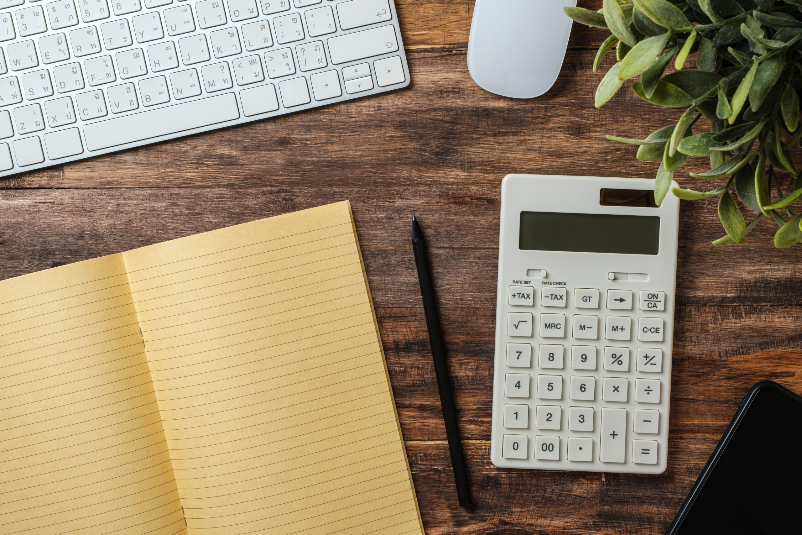 top view wood table with calculator and notebook working desk a